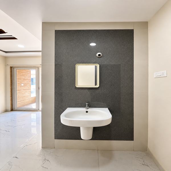 Modern washroom, stylish washroom, contemporary washroom, bathroom interior, wash basin area, wall mounted wash basin, designer bathroom, elegant bathroom, premium bathroom interior, modern basin design, bathroom mirror, wall mirror, vanity area, clean bathroom, spacious bathroom, luxury washroom, residential bathroom, apartment bathroom, flat bathroom, modern home interior, tiled bathroom wall, grey wall tiles, marble flooring, white wash basin, minimalist bathroom, functional bathroom, aesthetic bathroom, bright bathroom interior, neat washroom, sophisticated interior, premium home, modern residential interior, stylish basin area, bathroom sink, ceramic wash basin, wall mounted sink, contemporary home, elegant home interior, modern apartment, clean interior design, bathroom fittings, washroom design ideas, luxury home interior, simple bathroom design, modern property interior, spacious home, residential property, ready to move home, comfortable living space, high quality interior.